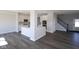 Open concept area showcasing the kitchen island, white cabinets and modern floors at 4229 Douro Trl, Westfield, IN 46062