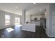 Open concept living space with modern floors, stainless appliances, and bright natural light at 4229 Douro Trl, Westfield, IN 46062