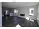 Spacious living room with modern floors, recessed lights, and cozy fireplace at 4229 Douro Trl, Westfield, IN 46062