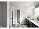 Bathroom with dual vanity, dark brown cabinets and a shower at 453 Gathering Ln, Greenwood, IN 46143