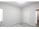 Bright bedroom with neutral walls and carpeting, featuring a window and door at 453 Gathering Ln, Greenwood, IN 46143