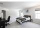 Bedroom with a bed, carpeted floor, desk and chair at 453 Gathering Ln, Greenwood, IN 46143