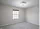 Bright bedroom with window and neutral walls at 453 Gathering Ln, Greenwood, IN 46143