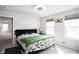 Well-lit bedroom with two windows and green comforter at 453 Gathering Ln, Greenwood, IN 46143
