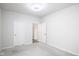 Spacious bedroom with neutral walls and carpeting, featuring two doors at 453 Gathering Ln, Greenwood, IN 46143