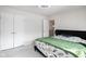 Spacious bedroom with double doors and green bedding at 453 Gathering Ln, Greenwood, IN 46143