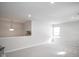 Bright bonus room with neutral walls and carpeting, featuring a half wall and window at 453 Gathering Ln, Greenwood, IN 46143
