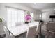 Modern dining room with white table and chairs at 453 Gathering Ln, Greenwood, IN 46143