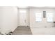 Bright entryway with gray vinyl plank flooring and neutral walls at 453 Gathering Ln, Greenwood, IN 46143
