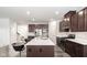 Modern kitchen with stainless steel appliances and island at 453 Gathering Ln, Greenwood, IN 46143