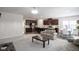 Open concept living and kitchen area with island and seating at 453 Gathering Ln, Greenwood, IN 46143