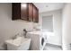 Laundry room with washer, dryer, and utility sink at 453 Gathering Ln, Greenwood, IN 46143