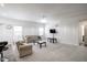 Spacious living room featuring plush sofas and a large TV at 453 Gathering Ln, Greenwood, IN 46143