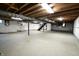 Unfinished basement with high ceilings and ample storage space at 4575 Ayrshire St, Indianapolis, IN 46228