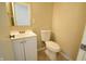 Clean bathroom with toilet, sink, and vanity at 4575 Ayrshire St, Indianapolis, IN 46228