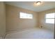 Spacious bedroom with painted floors and two windows at 4575 Ayrshire St, Indianapolis, IN 46228