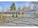 Brick ranch home with attached garage and landscaped yard at 4575 Ayrshire St, Indianapolis, IN 46228