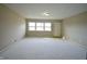 Living room with hardwood floors and neutral walls at 4575 Ayrshire St, Indianapolis, IN 46228