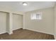 Bedroom boasts new floors and one window with a bright closet off to the side at 4632 Normal Ave, Indianapolis, IN 46226