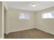 Bright bedroom with new floors and a view of the front yard from two windows at 4632 Normal Ave, Indianapolis, IN 46226