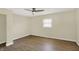 Spacious bedroom featuring a ceiling fan, and a window with blinds at 4632 Normal Ave, Indianapolis, IN 46226