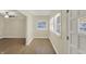 Inviting view of the entryway featuring hardwood floors, and abundant natural light from the windows at 4632 Normal Ave, Indianapolis, IN 46226