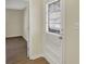 Entrance with windowed door, neutral paint, and wood-look floors at 4632 Normal Ave, Indianapolis, IN 46226