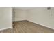 Spacious room with hardwood floors and neutral walls with an accent lamp at 4632 Normal Ave, Indianapolis, IN 46226