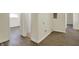 Open concept living room boasts wood-look flooring, an open doorway, and a closet at 4632 Normal Ave, Indianapolis, IN 46226