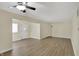 Open-concept living room with ceiling fan, hardwood floors, and natural light at 4632 Normal Ave, Indianapolis, IN 46226