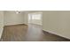 Bright living area featuring hardwood floors, natural light, and neutral walls at 4632 Normal Ave, Indianapolis, IN 46226