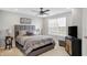 Serene bedroom featuring a gray upholstered bed at 6559 Seabiscuit Rd, Whitestown, IN 46075