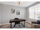 Bright home office with a large window, desk, and comfortable chair at 6559 Seabiscuit Rd, Whitestown, IN 46075