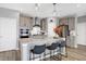 Modern kitchen with stainless steel appliances and an island with seating at 6559 Seabiscuit Rd, Whitestown, IN 46075