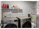 Laundry room with LG washer and dryer, and ample shelving for storage at 6559 Seabiscuit Rd, Whitestown, IN 46075