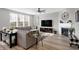Spacious living area with a corner fireplace and large windows at 6559 Seabiscuit Rd, Whitestown, IN 46075
