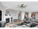 Spacious living room with a fireplace, large sectional sofa, and a flat-screen TV at 6559 Seabiscuit Rd, Whitestown, IN 46075