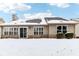 Exterior view of the backyard featuring a lawn covered in fresh snow with the house at 9519 Summer Ridge Pl, Indianapolis, IN 46260