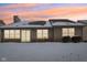 Backyard featuring sliding glass doors and large windows, offering ample natural light and views of the snow-covered yard at 9519 Summer Ridge Pl, Indianapolis, IN 46260