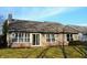 A sunny backyard with a well-maintained lawn and a view of the home's exterior at 9519 Summer Ridge Pl, Indianapolis, IN 46260