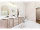 Elegant bathroom features dual vanities, stylish mirrors, and modern fixtures at 9519 Summer Ridge Pl, Indianapolis, IN 46260