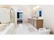 Bright primary bathroom showcasing a soaking tub and double sink vanity at 9519 Summer Ridge Pl, Indianapolis, IN 46260