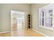 Bright bedroom featuring wood floors, large windows, and neutral wall colors at 9519 Summer Ridge Pl, Indianapolis, IN 46260