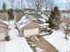 Aerial view of home showing a well-manicured lawn covered in snow at 9519 Summer Ridge Pl, Indianapolis, IN 46260