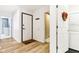 Hallway with neutral walls, tiled floors, and bright white trim at 9519 Summer Ridge Pl, Indianapolis, IN 46260