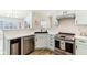 Kitchen featuring stainless appliances, wood floors, bright countertops, and a black sink at 9519 Summer Ridge Pl, Indianapolis, IN 46260