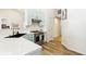 Updated kitchen featuring stainless appliances, a modern faucet, bright countertops, and sleek, light-green cabinetry at 9519 Summer Ridge Pl, Indianapolis, IN 46260