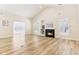 Bright living room with hardwood floors, vaulted ceilings, and a cozy fireplace at 9519 Summer Ridge Pl, Indianapolis, IN 46260