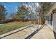 Wooden deck overlooking a spacious backyard with mature trees at 10322 Sage Ct, Noblesville, IN 46060