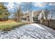 House exterior showcasing a deck and a partially snow-covered yard at 10322 Sage Ct, Noblesville, IN 46060